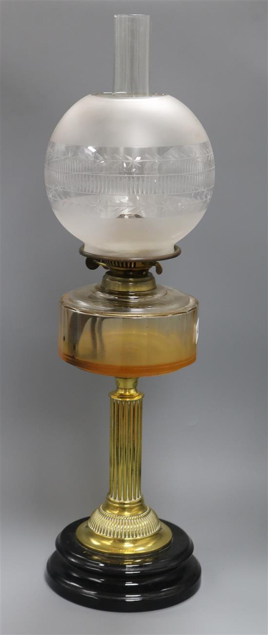 An oil lamp overall height 66cm